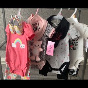 Bundle of Newborn baby girl clothes.